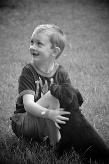 boy and puppy