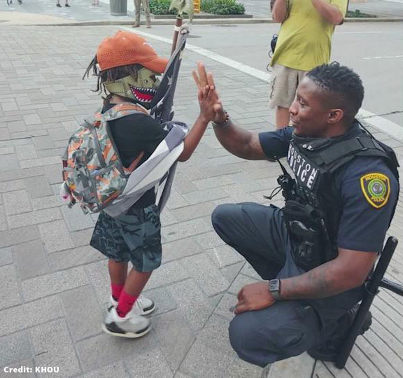 Police officer and 6 year old boy