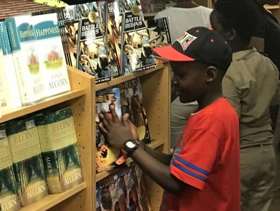 Child at the bookstore on Logos Hope