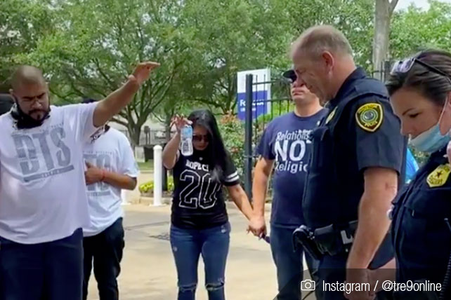 Protesters and Officers pray